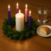Advent wreath with a piece of bread and glass of water next to it.